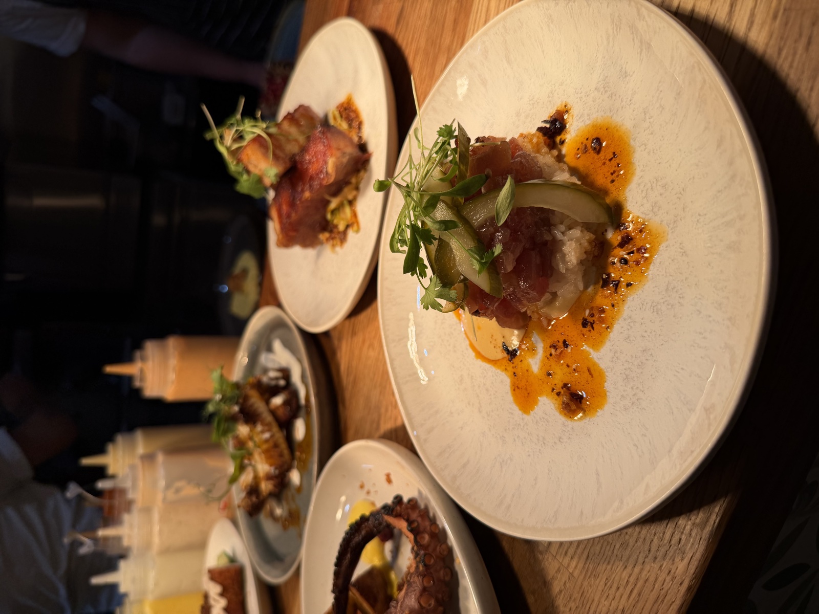 Chefs plating at the MIXA kitchen pass